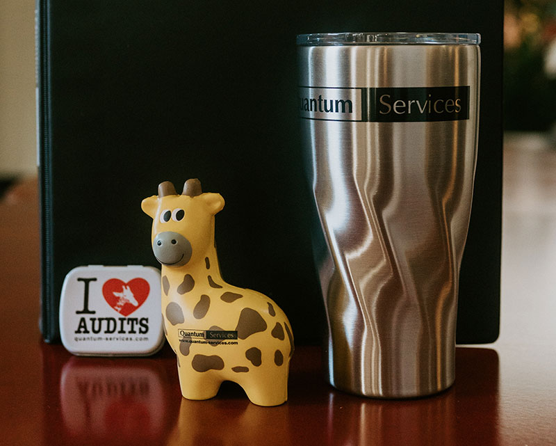 Quantum giraffe with coffee mug and sticker